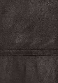 Black fabric with a smooth texture and slight sheen, featuring a visible seam line across the center with no distinct patterns or accents.