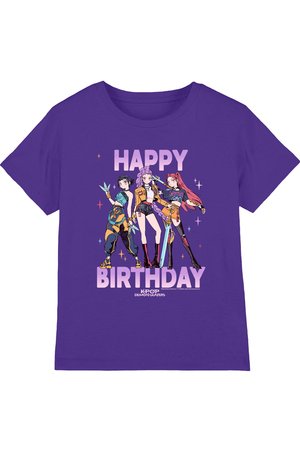 Purple t-shirt with three animated female characters holding weapons and text "HAPPY BIRTHDAY" and "KPOP DEMON HUNTERS" below them.