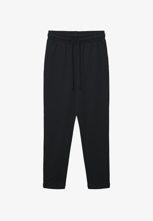 Pantaloni della tuta neri realizzati in tessuto morbido, con vita elastica con coulisse, orli con polsini e vestibilità comoda.