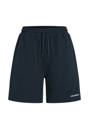 Shorts azul marino texturizados con cintura elástica y cordón. Presenta un pequeño logo blanco en la parte inferior de la pierna derecha.