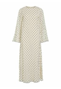 Lang kremhvit kjole med svarte polkadotter, rund halslinning og lange, lett vidde ermer. Har en sidesplit og subtil detaljering ved kanten.