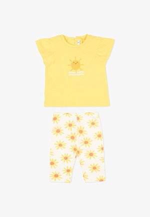 Camiseta amarilla de manga corta para bebé con gráfico de sol sonriente y leggings blancos con patrones de sol amarillos.