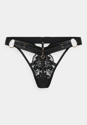 Μαύρο στρινγκ με δαντέλα στο πίσω μέρος, σατέν μπροστινό με χρυσές λεπτομέρειες, ρυθμιζόμενους ιμάντες και διακοσμητικό κουμπί.