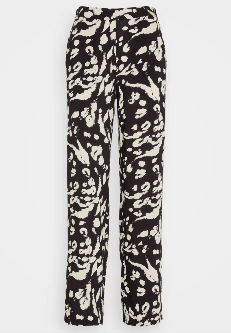 Black and white patterned pants with a loose fit, featuring a mix of abstract shapes on a lightweight fabric. Elastic waistband, straight legs.