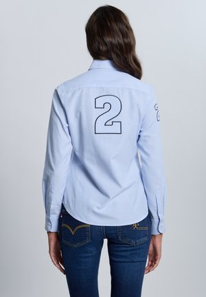 RAYAS MODELO ESCUDO - Blusa - azul celeste