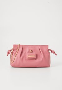 Pink leather handbag featuring a gathered design, gold chain strap, and a small front pocket with a branded plaque.