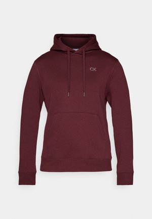 Burgunderfarbene Kapuzenjacke mit einer Fronttasche, Kordelzugkapuze und kleinem gesticktem "CK"-Logo auf der Brust. Gefertigt aus weichem Stoff, mit gerippten Bündchen.