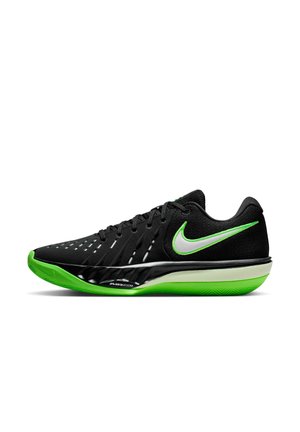 Chaussure de sport Nike Air Zoom noire et verte avec logo swoosh blanc et semelle vert vif, vue de côté sur fond blanc.
