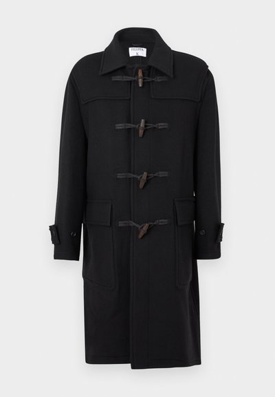 Zwarte wollen dufflecoat met een puntige kraag, toggelsluiting, twee zakken aan de voorkant en knoopmanchetten. Soepele textuur en lengte tot de knie.