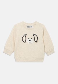 Μπεζ φούτερ με μοτίβο πρόσωπο σκύλου και μαύρες λεπτομέρειες στα αυτιά, με ριμπ μανσέτες και στρογγυλή λαιμόκοψη, κατασκευασμένο από μαλακό ύφασμα.