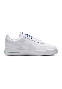 White low-top sneaker with blue laces, perforated toe, and green stripe on the sole, shown from the side on a white background.