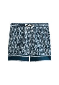 Shorts de bain bleu marine avec un motif géométrique blanc, taille élastique, fermeture à cordon de serrage et bord contrastant bleu foncé au bas.