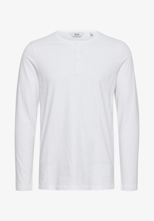 Langærmet hvid bomulds skjorte med rund halsudskæring, fem-knaps lukning og en glat tekstur. Enkel og klassisk design.