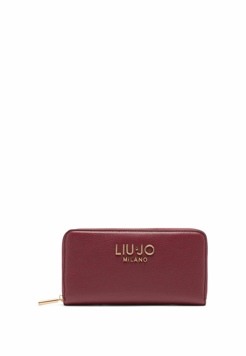 Tamsiai raudonas odinis piniginė su auksinės spalvos detalėmis, turinti logotipo elementą priekyje ir užtrauktuko uždarymą. Lygi tekstūra ir stačiakampio forma.