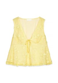Yellow sleeveless top with a deep V-neck, floral embroidery, tie detail at the center, and a flared shape. Sheer and textured fabric.