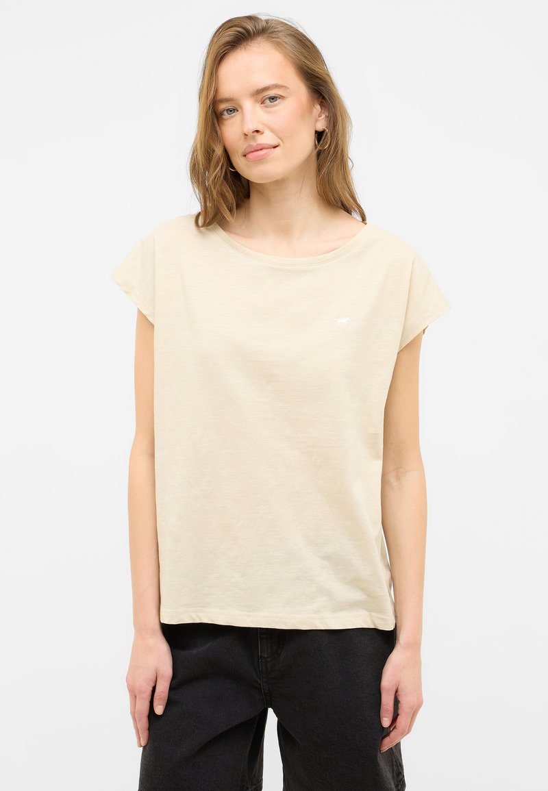 Short-sleeve, light beige t-shirt made of soft fabric. Features a round neckline and a small logo on the chest. Loose fit.