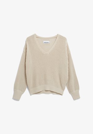 Beige gebreide trui met een V-hals, geribbelde textuur en lange mouwen met een cropped fit. Label zichtbaar aan de binnenkant van de halslijn.