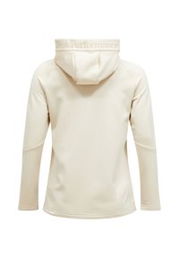 Világos bézs színű kapucnis pulóver, testhezálló fazonnal, hosszú ujjakból áll, és a hátsó nyakrészen diszkrét "Peak Performance" logó található. Simább textúrájú.