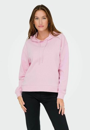 Rosa Kapuzenpullover mit entspannter Passform, ausgestattet mit Kordeln, gerippten Bündchen und weichem Material. Kombiniert mit schwarzen Leggings.
