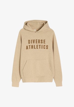 Beżowa bluza z kapturem z kieszenią z przodu, z napisem "DIVERSE ATHLETICS" w brązowych dużych literach na klatce piersiowej.