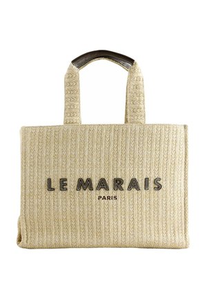 Geantă tote bej țesută, cu mânere robuste, cu inscripția "LE MARAIS PARIS" în litere negre pe partea din față, în centru.