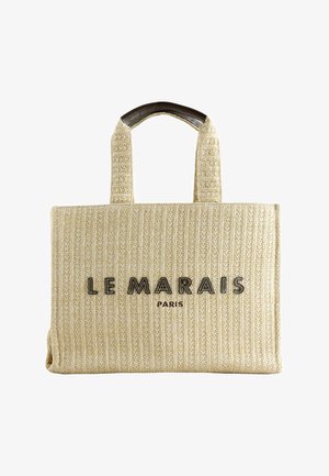 Beežist kootud kandekott tugevate sangadega, esiküljel keskel reljeefsete mustade tähtedega "LE MARAIS PARIS".