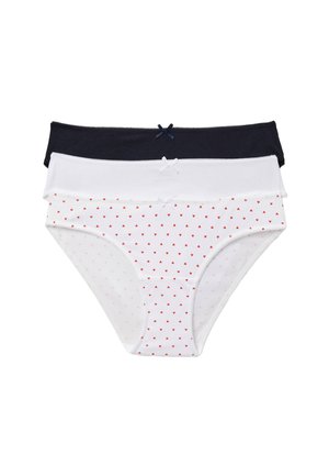 Femme portant un haut moulant côtelé bleu marine à manches courtes avec bordure en dentelle et une lingerie assortie bleu marine, debout devant un fond clair uni.
