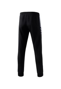 Schwarze Sporthosen mit einem körpernahen Design, elastischem Bund und schmal zulaufenden Bündchen; ausgestattet mit seitlichen Akzenten in Grau mit gestreiften Mustern.