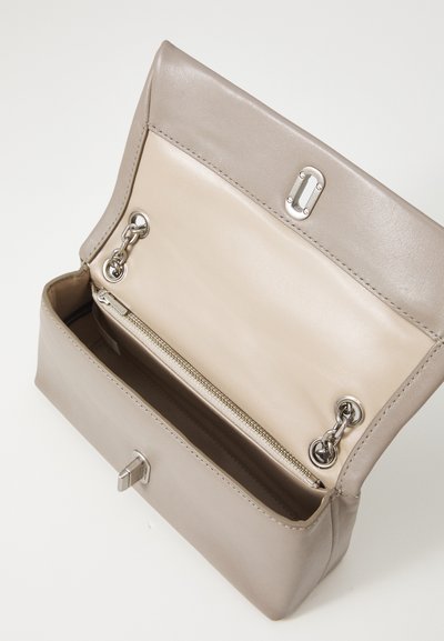 Gray leather handbag with a smooth texture, featuring a flap closure, silver hardware, and a beige interior with a zippered pocket.