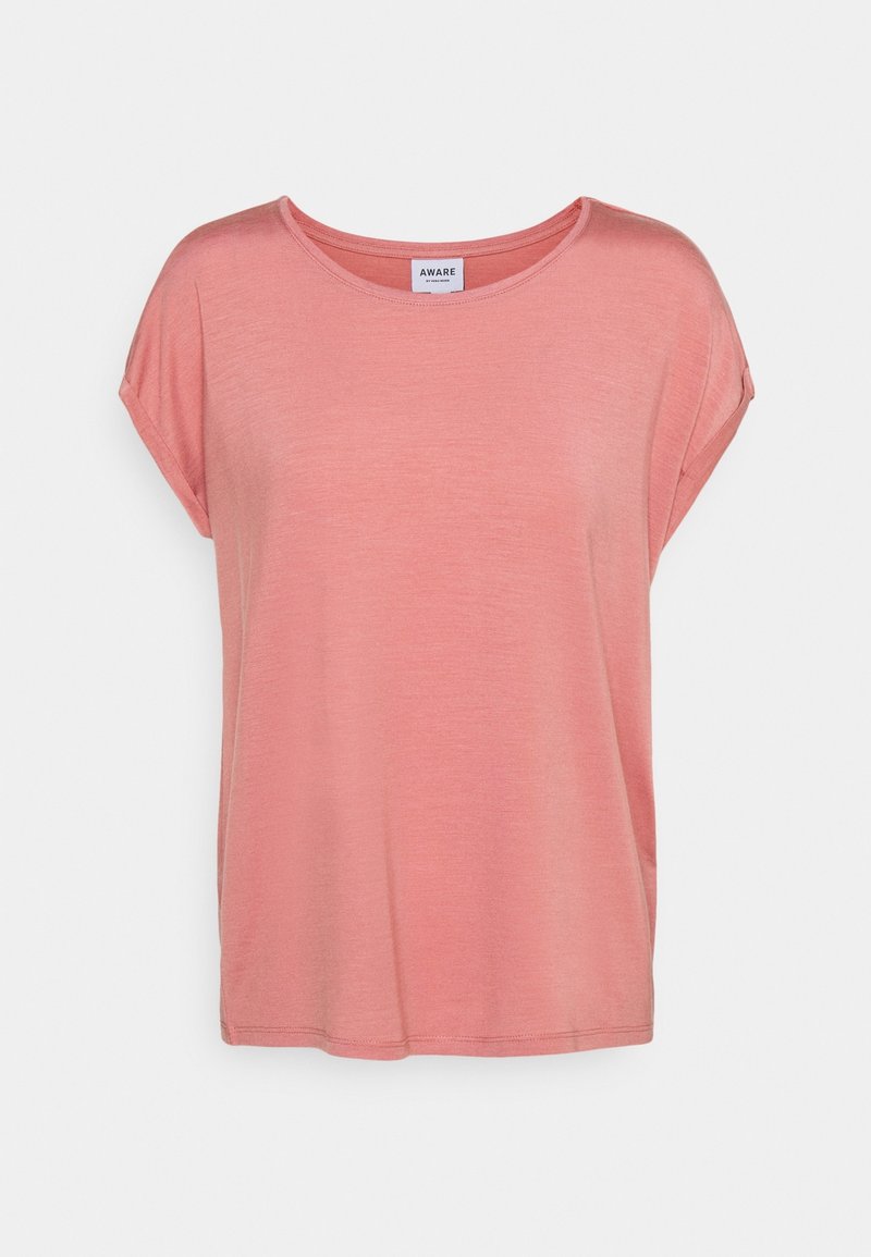 T-shirt rose à manches courtes, coupe ample, avec col rond et bords de manches retroussés sur un fond uni.