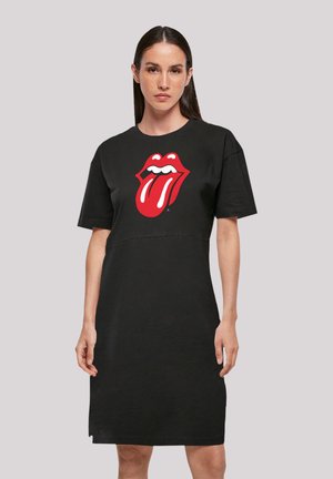 Schwarzes Baumwoll-T-Shirt-Kleid mit einem großen roten Rolling Stones Zungenlogo auf der Vorderseite. Kurze Ärmel und eine lockere Passform.