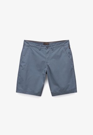 Šedé bavlněné kraťasy s plochým předním dílem, zapínáním na knoflík a dvěma bočními kapsami. Disponují kontrastním švem a štítkem na pásku.