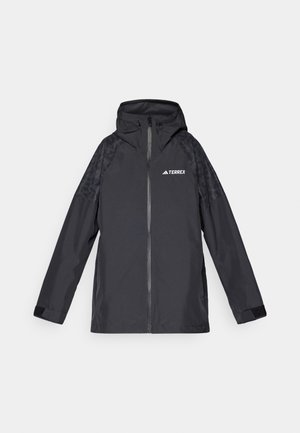 Mustat vedenpitävät takki huppulla, vetoketjusuljenta ja mustat teksturoidut korostukset hartioilla. Rintamuksessa on "TERREX"-logo.