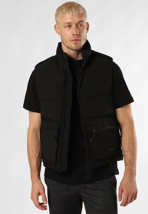 Black puffer vest with high collar, full front zipper, and two zippered pockets. Fabric has a smooth texture, minimalistic design.