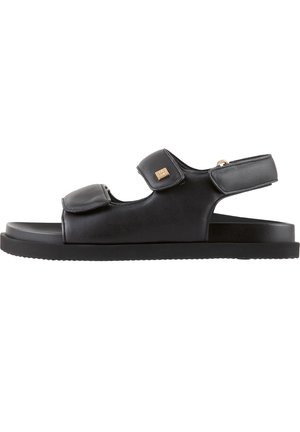 Black leather sandal with two adjustable Velcro straps, open toe design, contoured footbed, and a textured rubber sole.