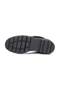 Black rubber shoe sole with a textured pattern, featuring segmented grooves for traction. The sole includes a logo and size labeling.