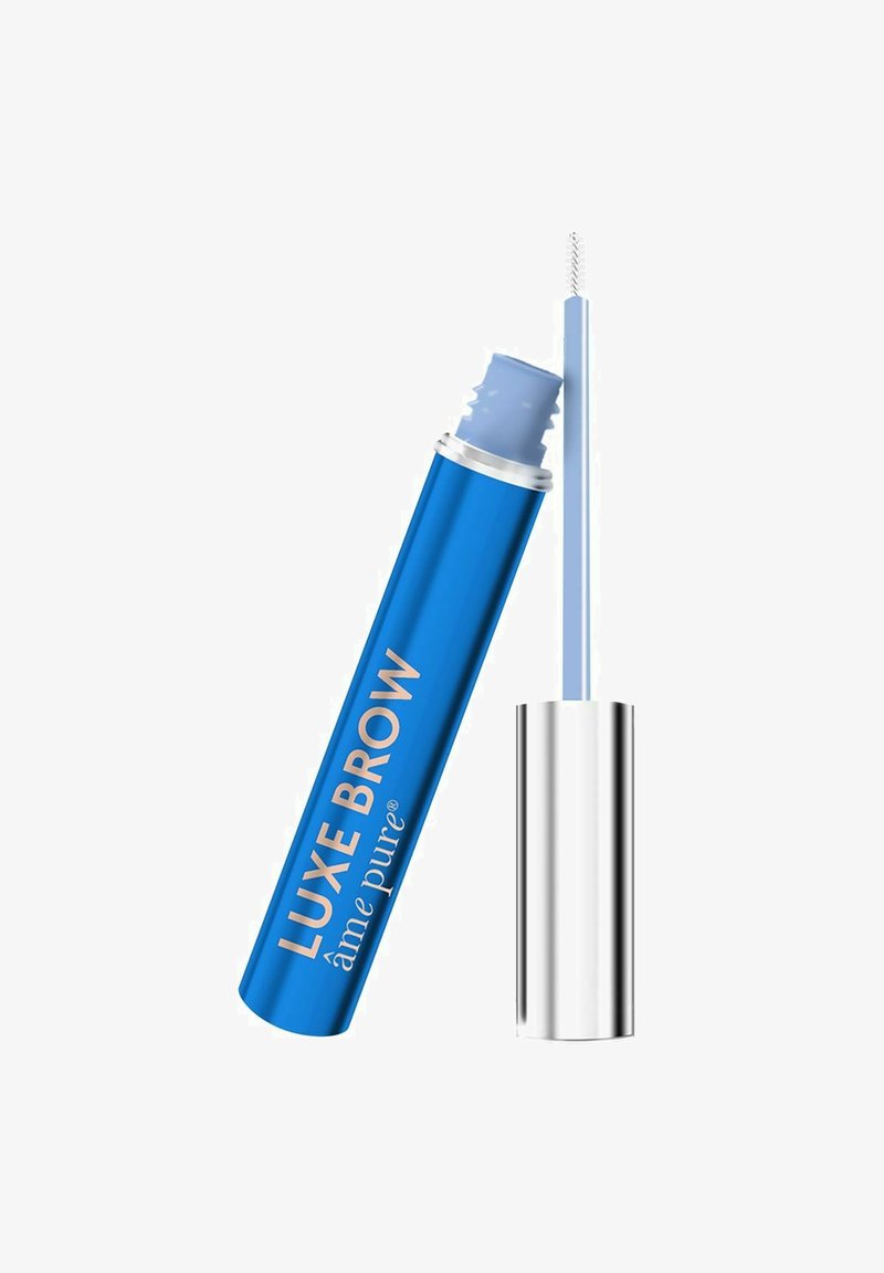 Blå sylinderformet tube med sølvhette, merket "LUXE BROW." Klar applikatorbørste med teksturerte børster for pleie av bryn.