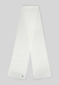 Écharpe blanche en tricot avec une texture lisse, ornée d'un ourlet décoratif avec de petits points colorés et un accent métallique à l'extrémité.