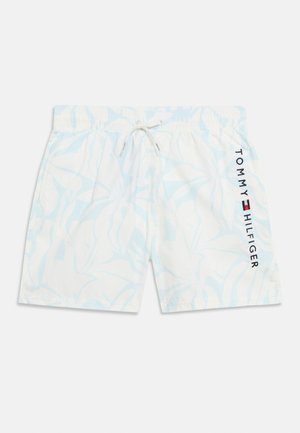 Fehér úszónadrág világoskék trópusi leveles mintával, rugalmas derékrésszel, húzózsinórral és függőleges "Tommy Hilfiger" logóval a jobb lábszáron.