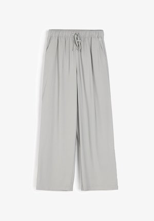 Jasnoszare kuloty wykonane z miękkiego, rozciągliwego materiału, z elastycznym paskiem w talii, regulowanym sznurkiem oraz kieszeniami bocznymi.