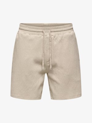Shorts décontractés beige clair avec taille élastique et cordon de serrage, faits en tissu texturé, avec poches latérales.