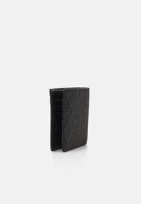 Black wallet with textured exterior, multiple card slots, and a sleek, minimalist design. Compact rectangular shape.