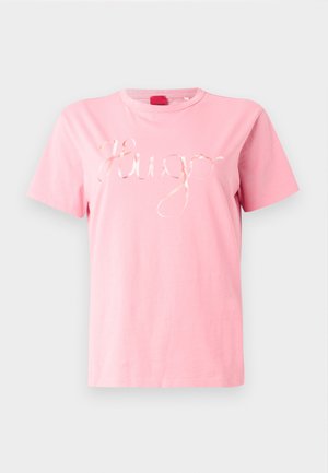 Pink cotton T-shirt with short sleeves and a crew neckline, featuring a shiny cursive "Hugo" logo in the center. Smooth texture.