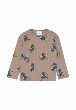 Beige ribbed long-sleeve shirt with repeating cartoon mallard duck wearing blue overalls pattern.