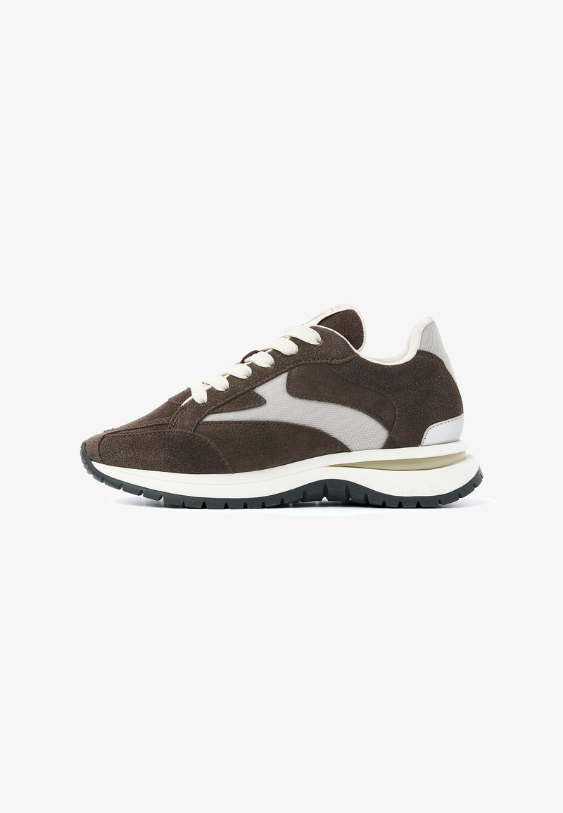 Brown suede sneaker with mesh accents, white laces, and a thick white midsole. Features a textured rubber outsole for grip.