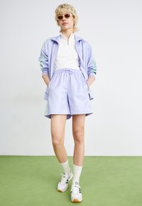 adidas Originals FASHION MONOGRAM - Tracksuit bottoms - violet tone