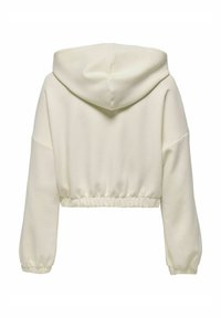 Zkrácená mikina v světle krémové látce s kapucí, elastickým lemem a prostornými rukávy. Hladká textura, minimalisticický design, žádné viditelné vzory.