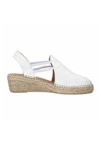 Espadrille en cuir blanc avec un talon compensé, dotée de sangles élastiques, d'un bout rond et d'une semelle en jute tressé. Texture lisse et design épuré.