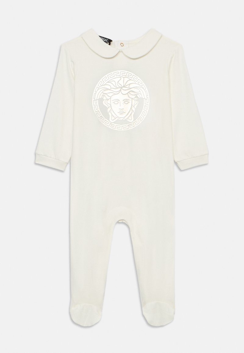 Βαμβακερή ολόσωμη φόρμα για μωρά σε κρεμ απόχρωση, με κυκλικό λογότυπο Μενδούσας στο κέντρο, επίπεδο γιακά και μανίκια και πόδια με περιθώρια.