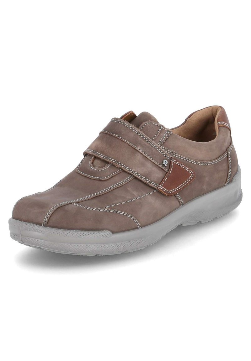 Brown leather sneaker with a Velcro strap, grey rubber sole, contrasting stitching, and subtle brown accents on the strap.